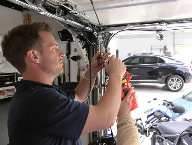 Wadsworth Garage Door Repair safety certified technician performing cable replacement in Wadsworth
